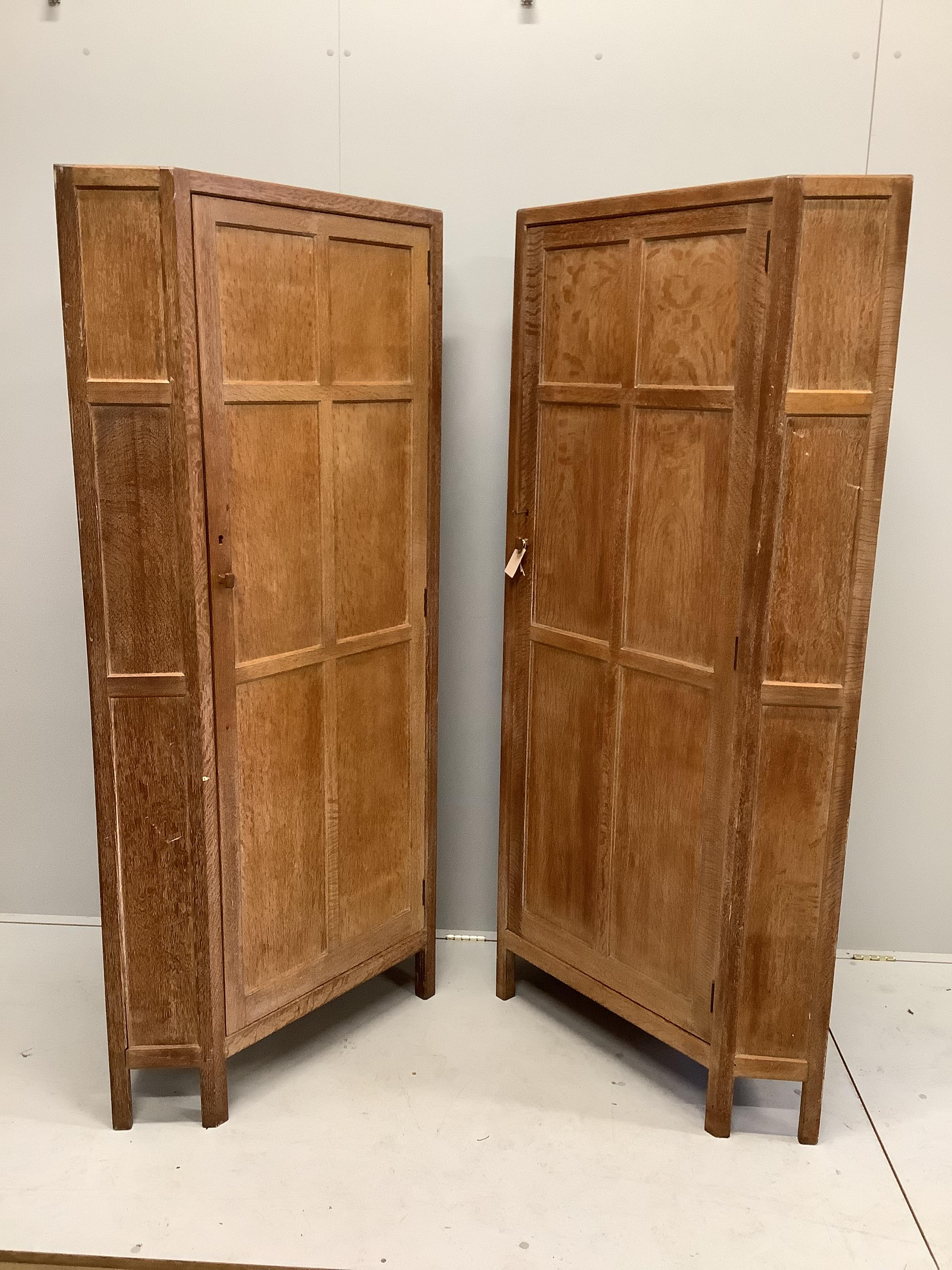Heal & Son Ltd., London, a pair of bleached oak corner wardrobes, width 94cm, depth 53cm, height 182cm